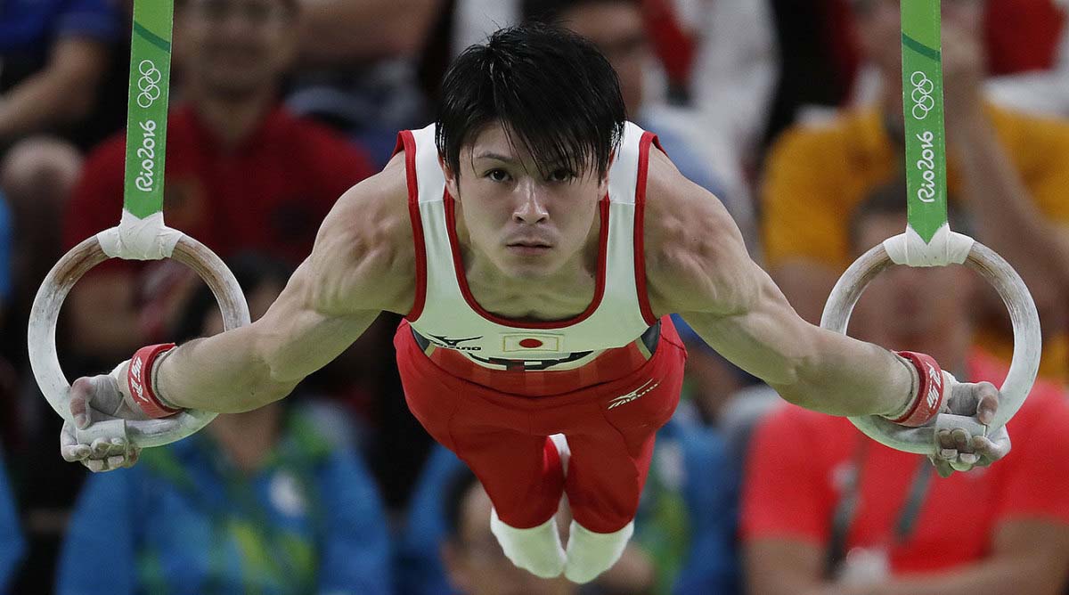 Uchimura holding a maltese